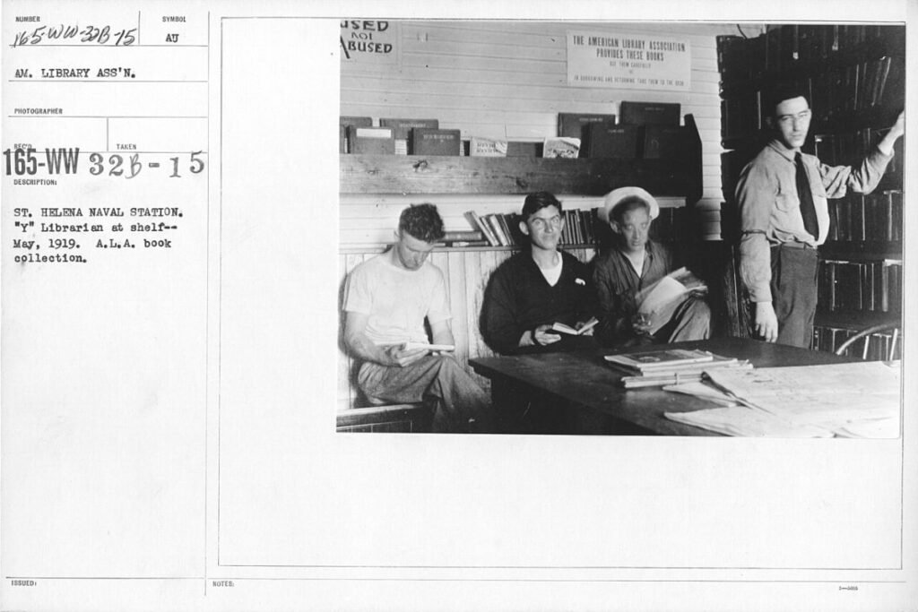 American Library Association - Miscellaneous - St. Helena Naval Station. "Y" Librarian at shelf -- May, 1919. A.L.A. book collection - NARA - 20801470