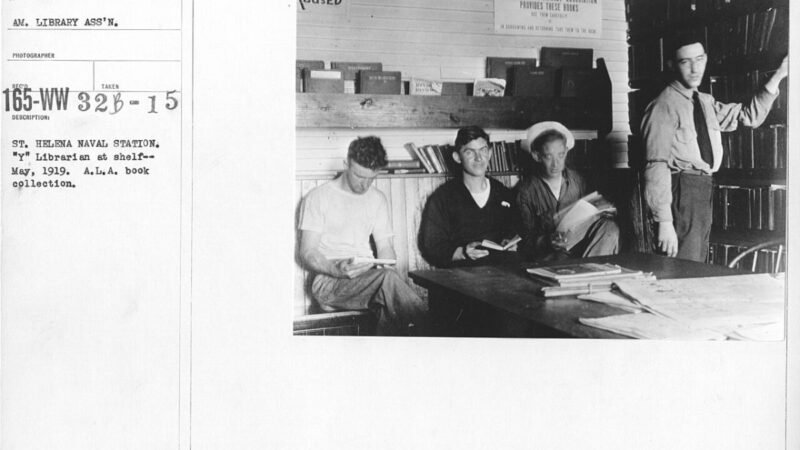 American Library Association - Miscellaneous - St. Helena Naval Station. "Y" Librarian at shelf -- May, 1919. A.L.A. book collection - NARA - 20801470