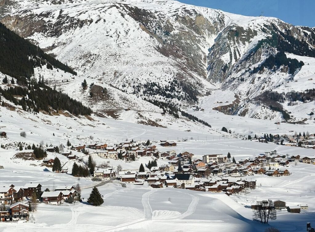 Town in Swiss Alps seen from Glacier Express Switzerland